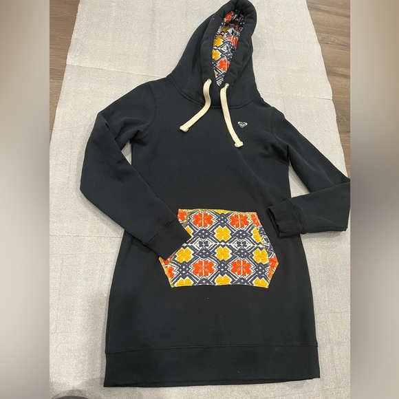 [S]Roxy Black Hoodie Dress Tunic with Vibrant Patterned Pocket - Picture 1 of 8
